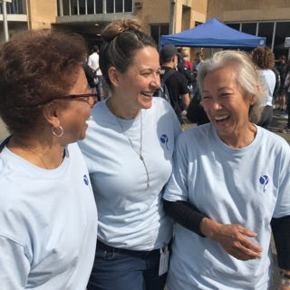 Volunteers in matching cause tees at a community event