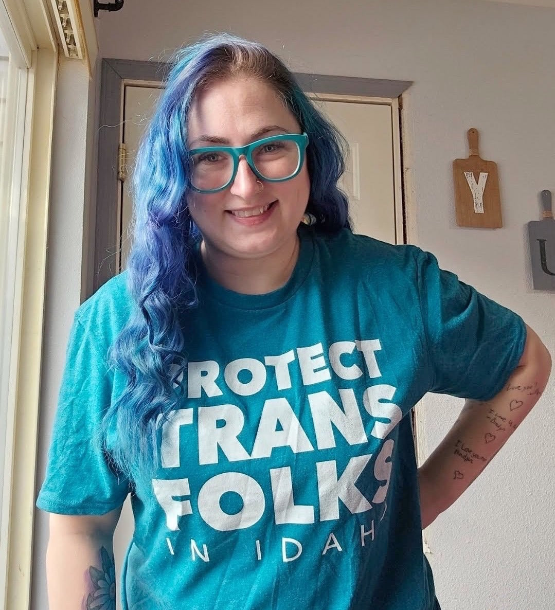 Supporter wearing a custom awareness tee with a bold front-print cause design