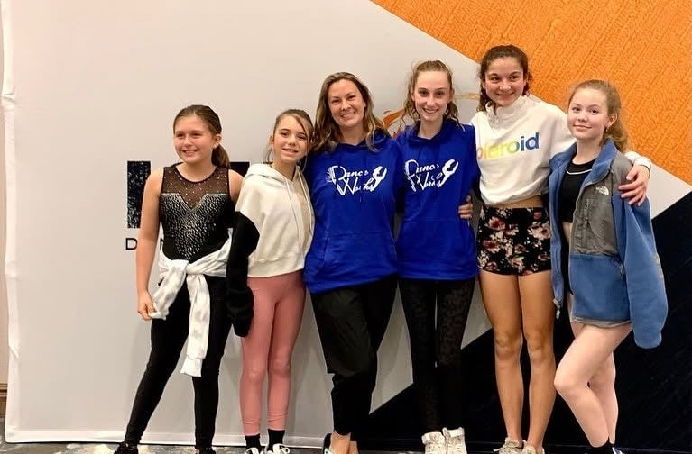 Dance team members in matching custom hoodies
