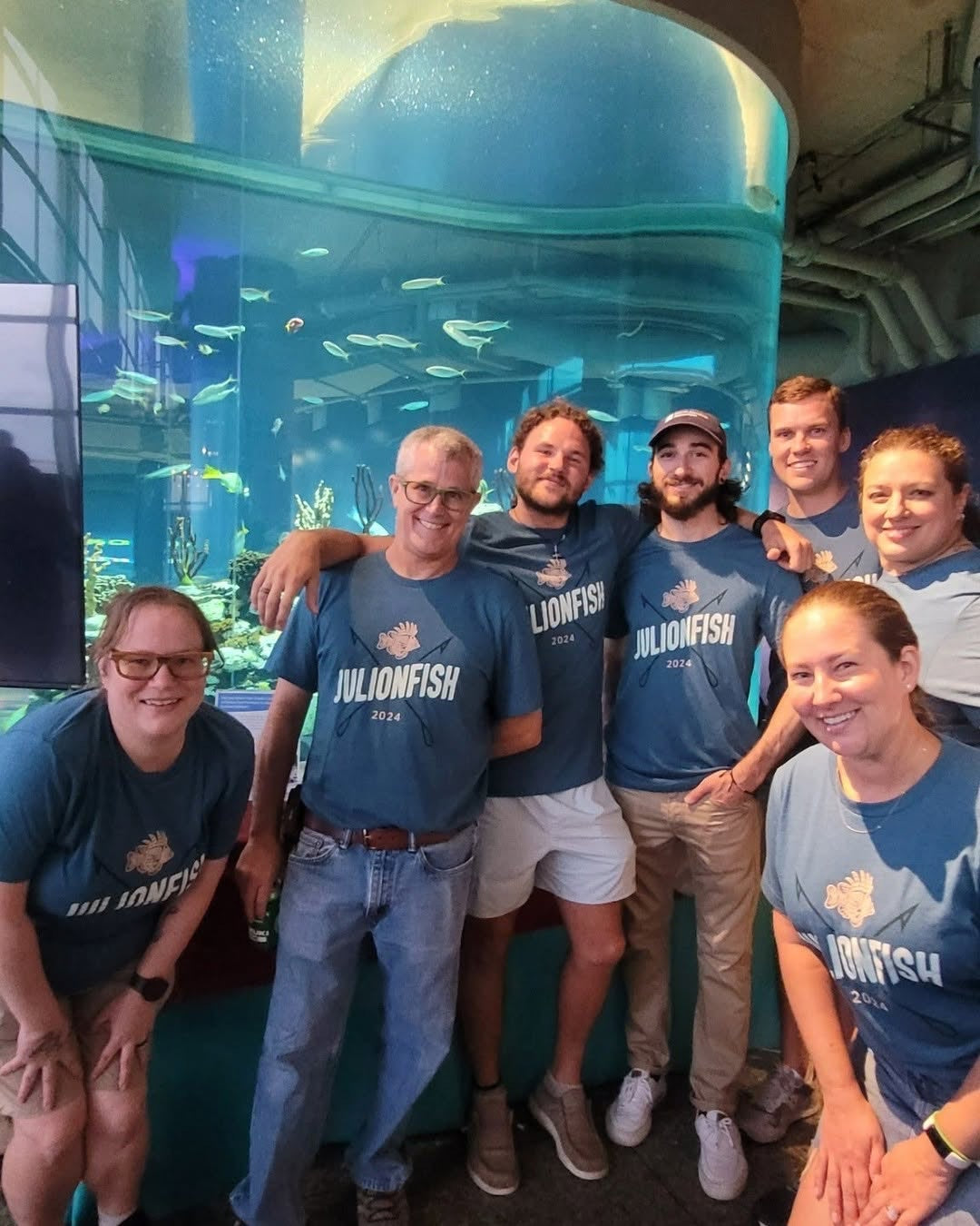 Conservation team in matching cause t-shirts at an aquarium outreach event