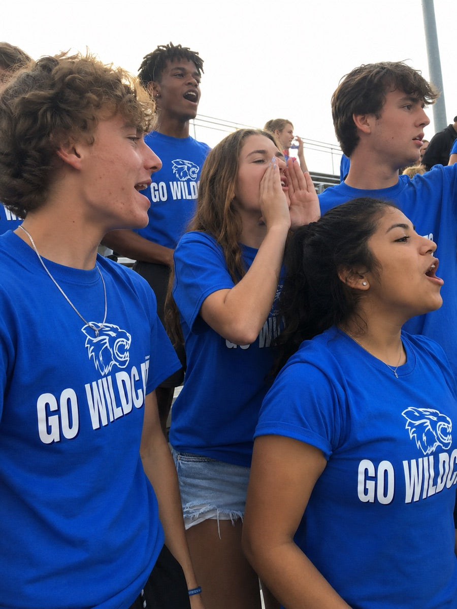 Students in matching GO WILDCATS school spirit shirts