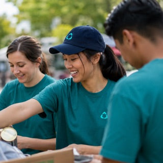 Volunteers in branded tees at an event